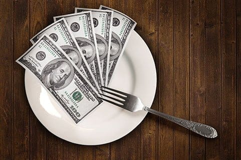 money on a dinner plate